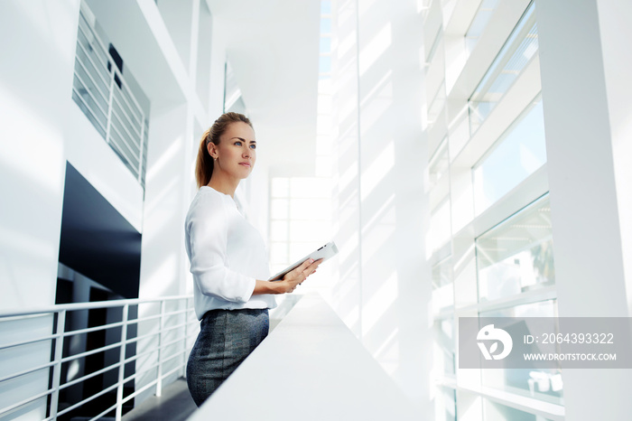 Woman successful lawyer talking on mobile phone after work on digital tablet