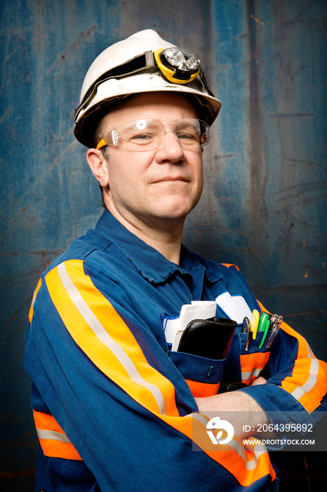 Portrait of industrial worker with arms crossed