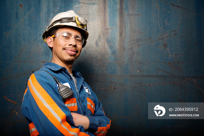 Portrait of industrial worker with arms crossed