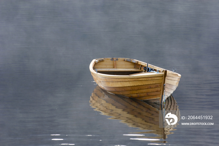 A single wooden rowing boat 