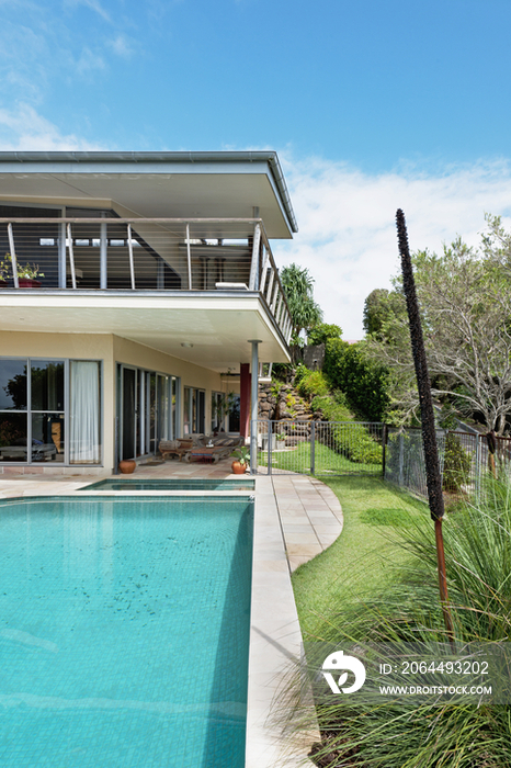 Swimming pool in front of house