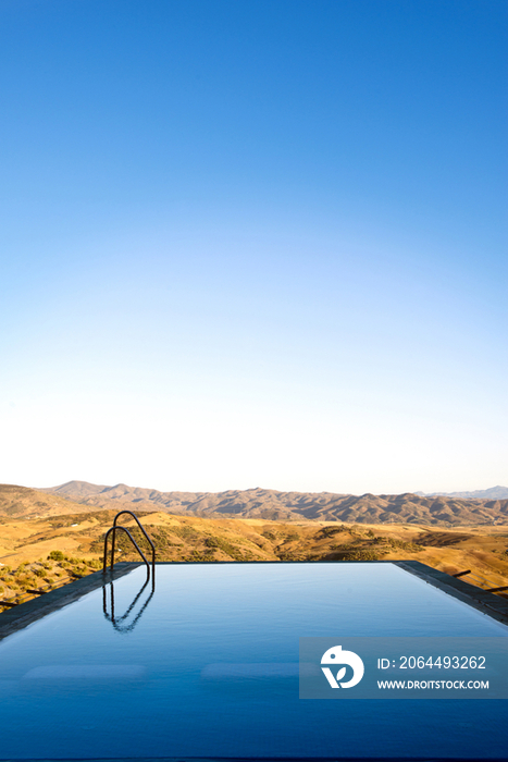 An infinity water pool with steps 