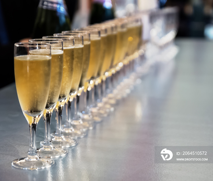 Row of full champagne glasses