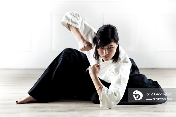 beautiful woman wearing a hakama practicing Aikido