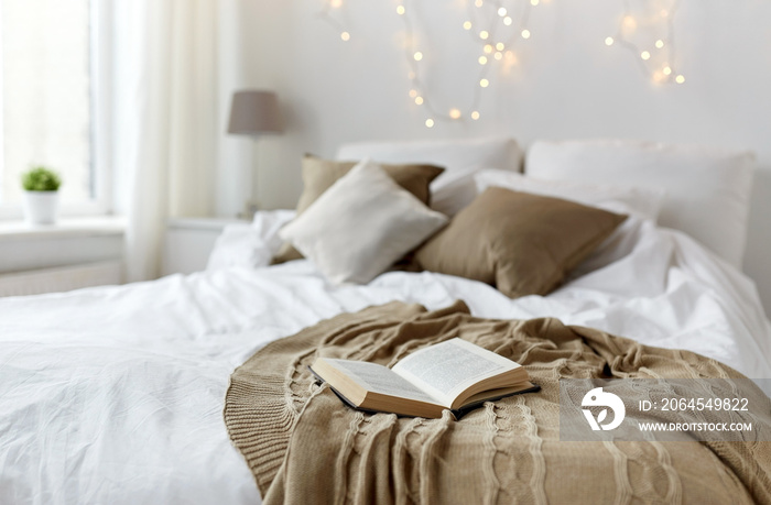 bedroom with bed and christmas garland at home