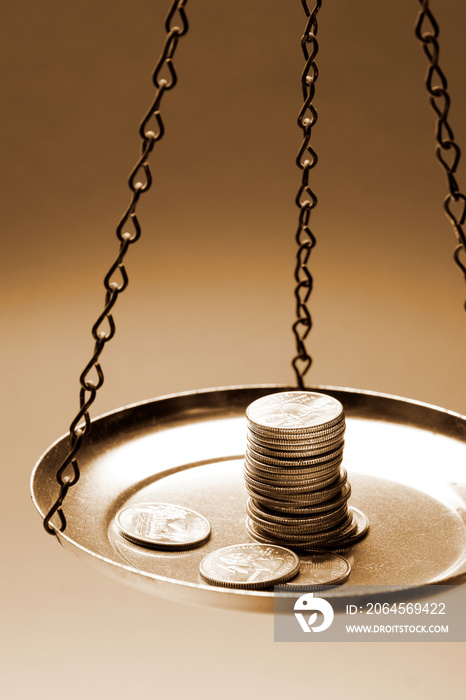 money on a balance scale