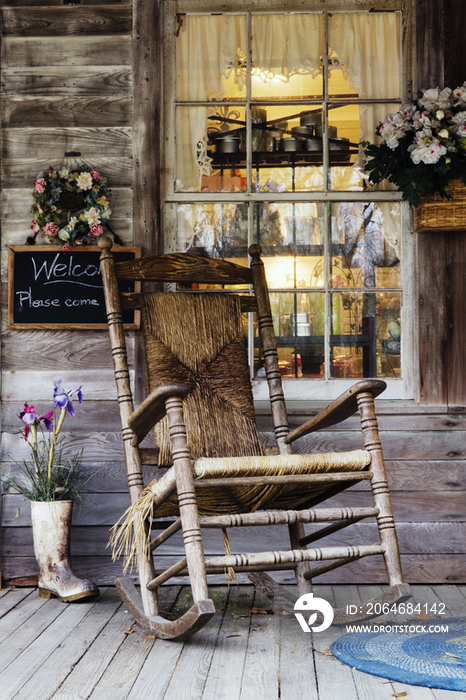 Old Wooden Rocking Chair on a Wooden Porch