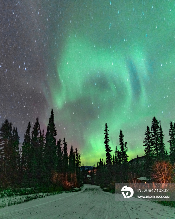 Fantastic display of northern lights with stunning green & purple bands, swirls and spears. Taken in