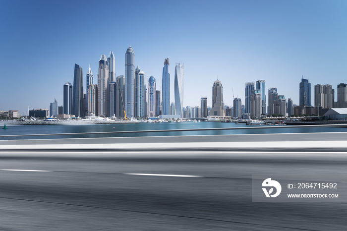 empty asphalt road with modern city skyline