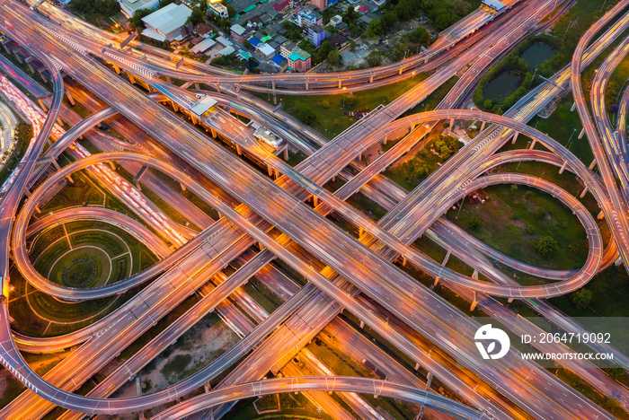 Aerial view of highway at rush hour at night time with car trail and traffic. view from drone