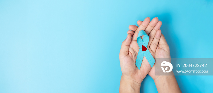 November World Diabetes day Awareness month, Woman holding light Blue Ribbon with blood drop for sup