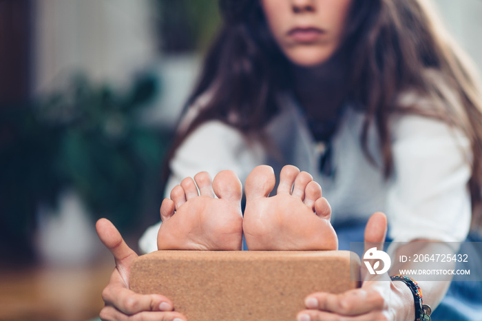 Yoga Block. Woman Practicing with Yoga Block