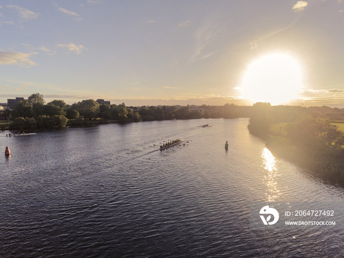 Eight shell practice, River Corrib, Galway city, Ireland, Sunset, muted colors. Aerial view. calm sc