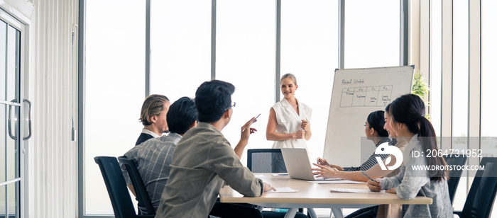 Woman leader working brainstorm to solve problem with team, presentation new idea. People discuss an