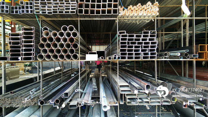 Steel pipes profile stack. New square metal pipes in stock. Stack of steel, Steel material. Steel wa