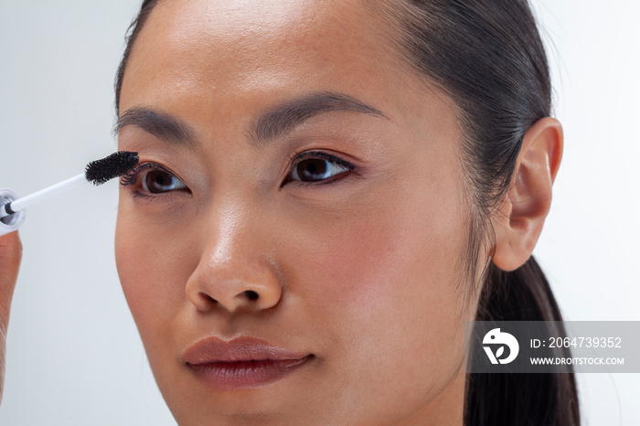 Close-up�of woman applying mascara