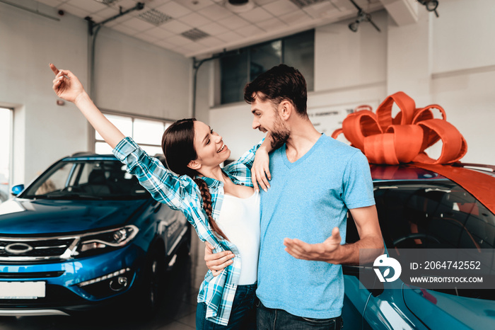 A Guy Presents A Car To Girlfriend. Gift Concept.