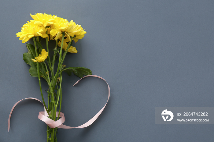 Yellow chrysanthemum flowers on dark background