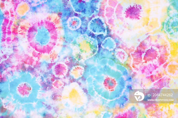 colorful tie dye pattern hand dyed on cotton fabric abstract texture background.