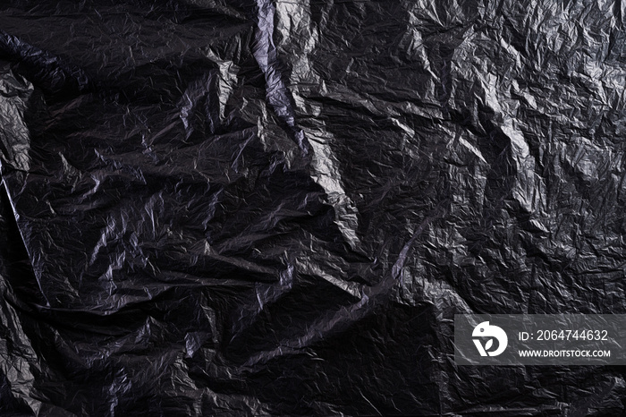 黑色塑料袋纹理和背景的俯视图。减少塑料袋用于自然处理