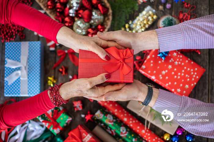 Adult hands preparing many gifts