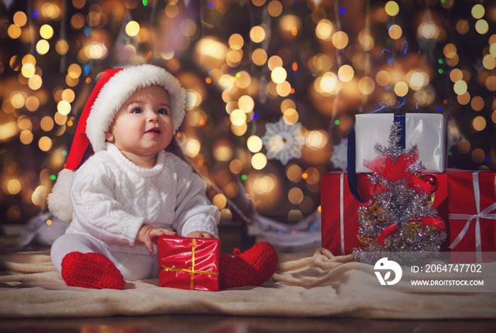 Little boy in Christmas Santas hat, Against the backdrop of a C