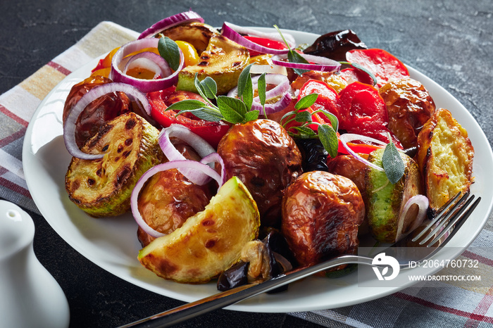 roasted hot vegetables on a white plate