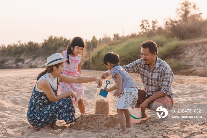 Family playing on the beach