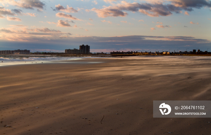 Empty Beach in Far Rockaway, New York. Sandy beach with cloudy Sky