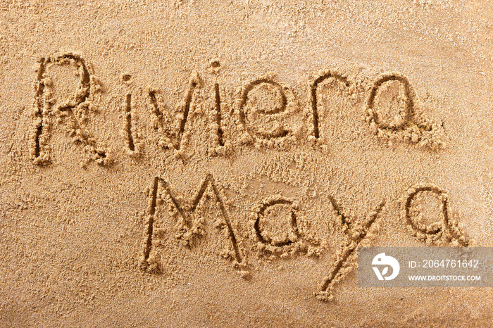 Riviera maya mexico cancun word written in sand on a sunny mexican summer beach holiday vacation tra