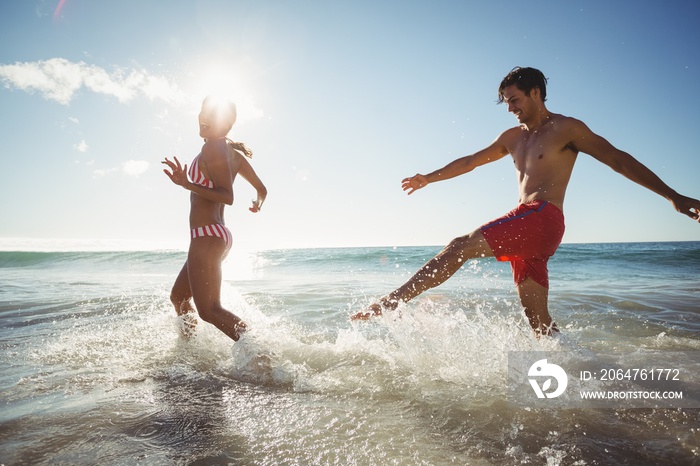 Couple playing in water