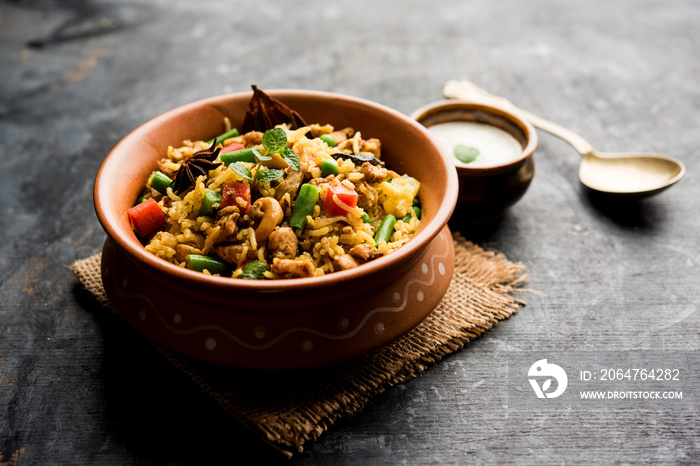 Kheema Pulao - Rice cooked with mutton or chicken mince with vegetables and spices. served in a bowl