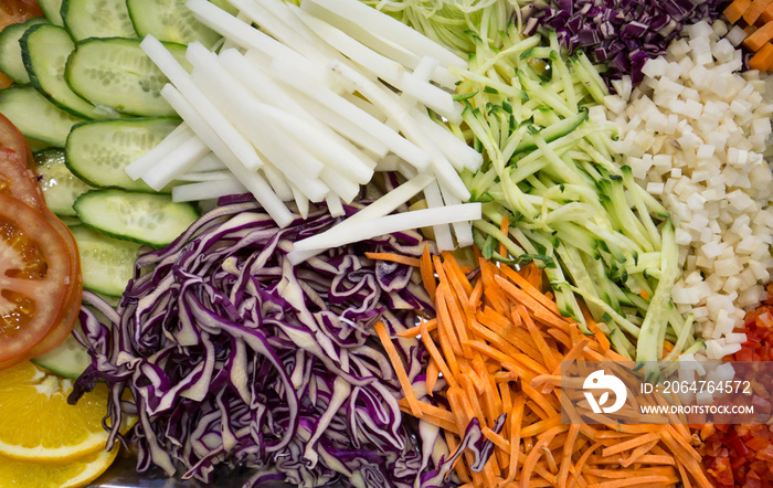 Different raw shredded vegetables as an example of a healthy diet