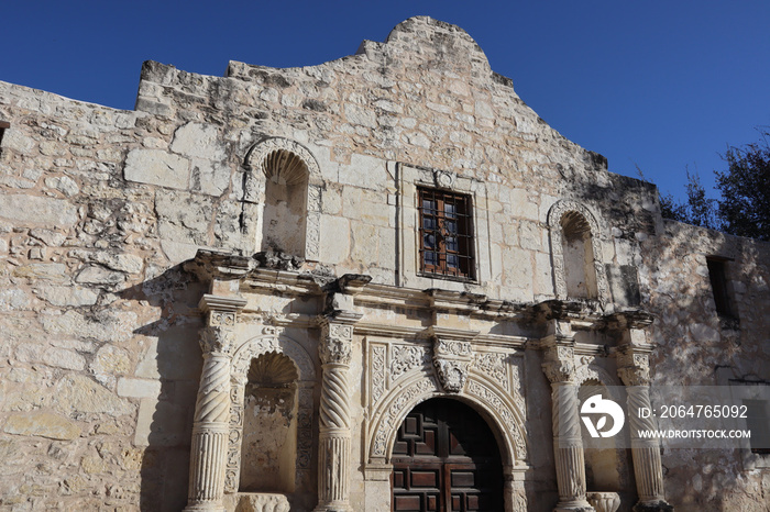 Texture of a rock wall and doorway at the entrance of The Alamo in San Antonio, Texas