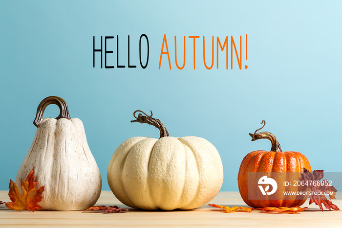 Hello autumn message with pumpkins on a blue background