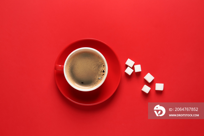 Cup of hot coffee and sugar on color background