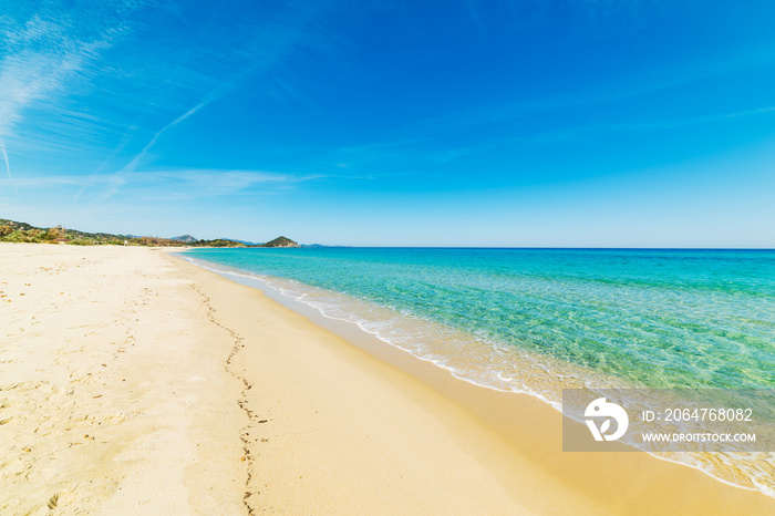 Golden shore in Cala Sinzias