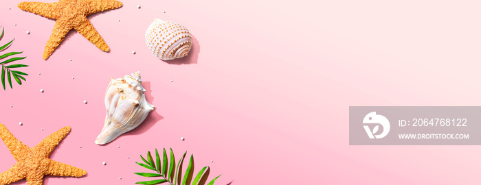 Summer concept with starfish and seashells overhead view - flat lay