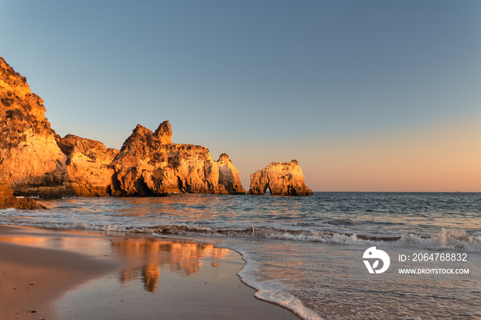 view of  the Alvor beach in Algarve, Portugal at sunset.