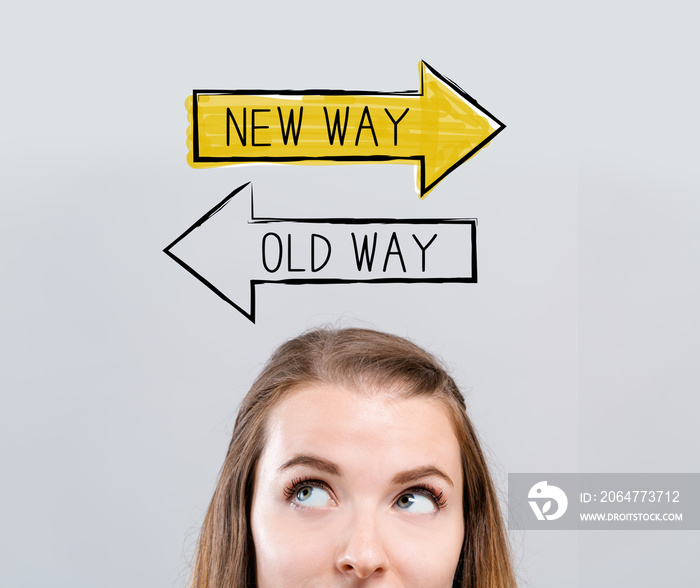 Old way or new way with young woman looking upwards