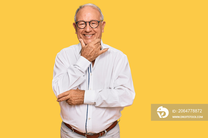 Senior caucasian man wearing business shirt and glasses looking confident at the camera smiling with