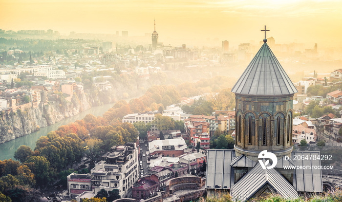 beautiful sunset view of Tbilisi and Saint Nicholas Church from Narikala Fortress, Georgia