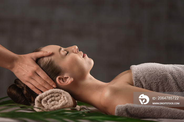 Young woman having massage in spa salon