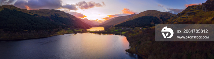 Scottish beautiful colorful sunset landscape with Loch Voil, mountains and forest at Loch Lomond & T