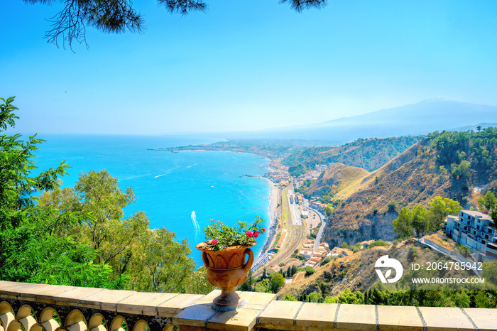 Beautiful landscape of waterfront Taormina. Panoramic view from city public park. Sicily, Italy