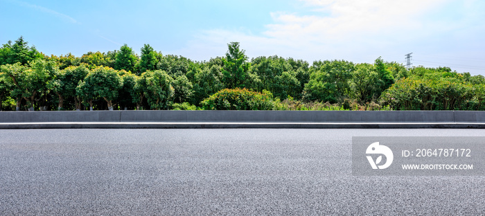 Asphalt highway and green forest with beautiful clouds landscape