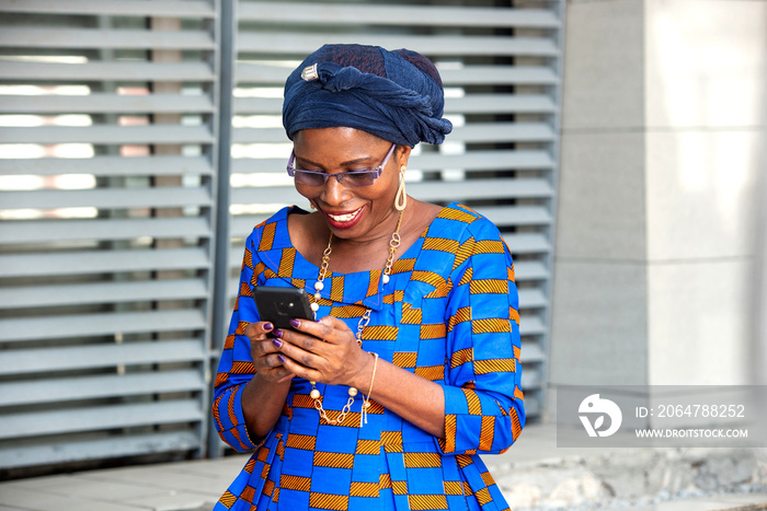 beautiful adult businesswoman using a mobile phone.