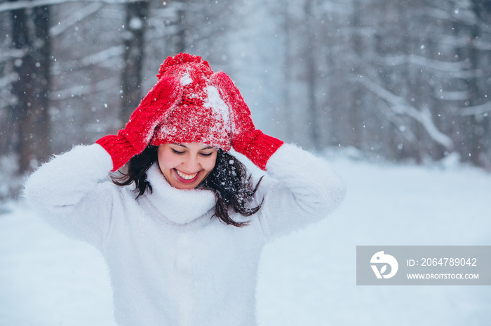 beautiful woman portrait outdoors in snowed forest