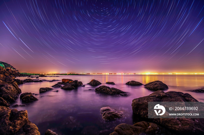 sea at night and beautiful Milky Way,  sea and star tracks