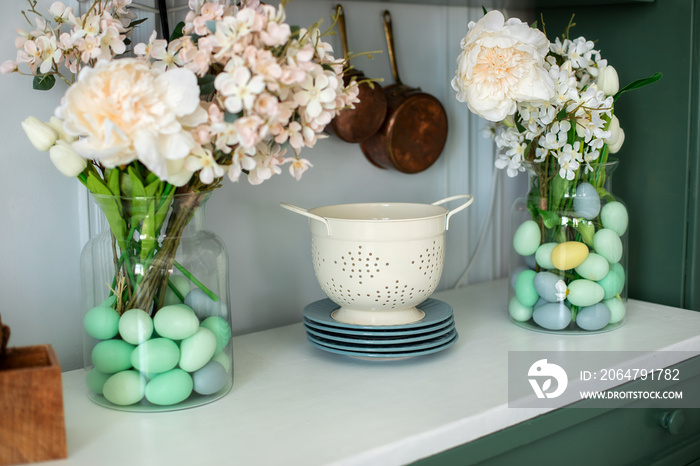 Front view of countertop with kitchen tools, utensils. Spring kitchen interior decor. Enameled white